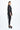 Woman wearing a black metallic outfit on a white background