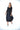 Woman wearing a black dress with a white background