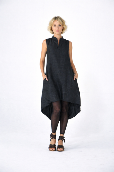 Woman wearing a black sleeveless dress on a white background