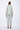 Person wearing a light green suit on a white background