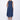 A woman wearing a navy blue  sleeveless knee-length dress with pockets in a white background setting.