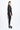 Woman wearing a black metallic outfit on a white background