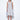 A female model wearing a sleeveless knee-length dress with horizontal black stripes and round neckline, standing against a white background.