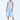 Woman wearing a light blue dress with oversized pockets on a white background