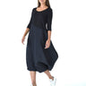 Woman wearing a black dress with a white background