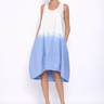 Woman wearing a white and blue dress on a white background