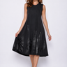 Woman wearing a black sleeveless dress on a white background