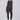 Woman wearing a black sleeveless top and leggings on a white background
